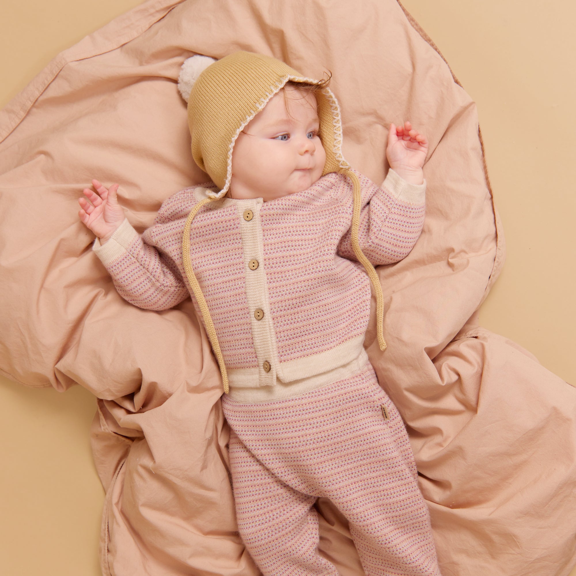 wheat-pomma-strickm-tze-honey-peach-merinowolle-baby image 2