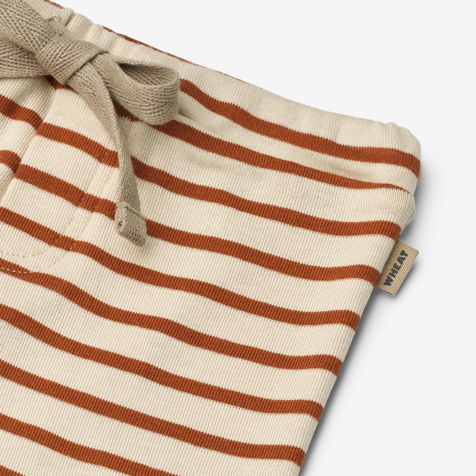 wheat-hose-manfred-babyhose-warm-caramel-stripe-bio image 3
