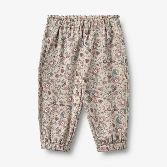 wheat-cosmo-sweatpants-baby-jogginghose-soft-sand-flowers image 1