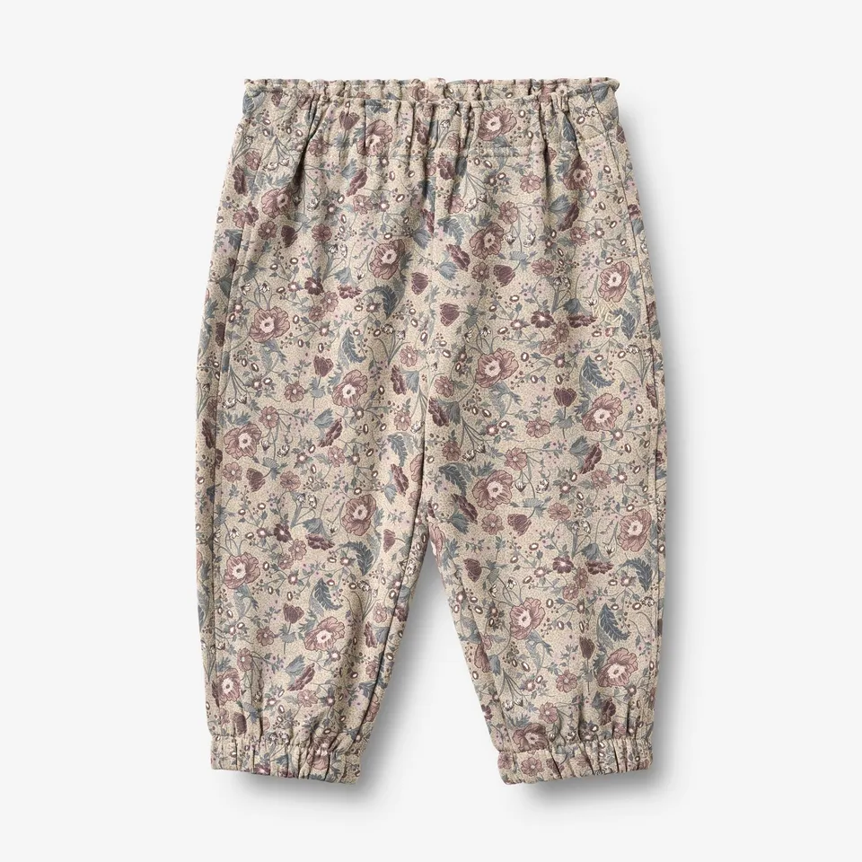 wheat-cosmo-sweatpants-baby-jogginghose-soft-sand-flowers image 1